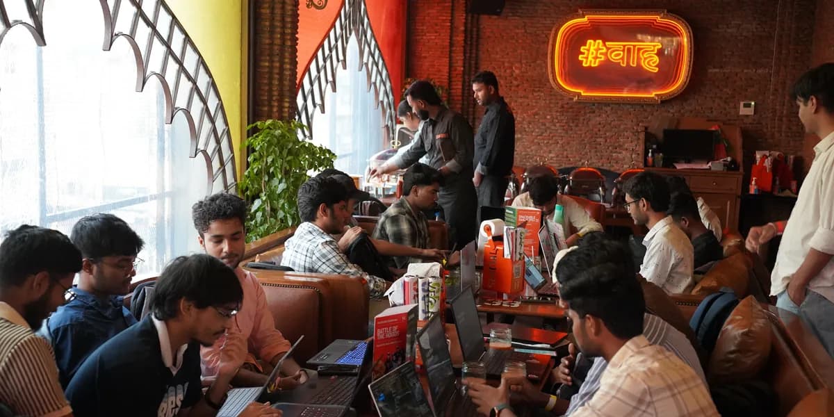 Builders at work during the Agentic Premier League, a GDG Lucknow hackathon
